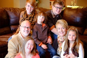 Image of a family of 7 with 3 children with down syndrome